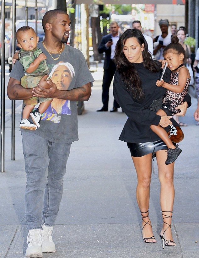 Kim Kardashian and Kanye West with their children